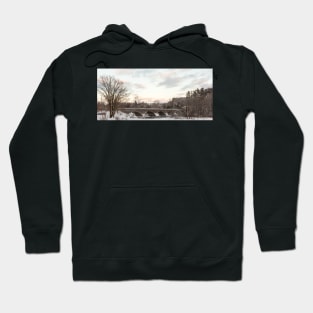 A snowy winter landscape Hoodie